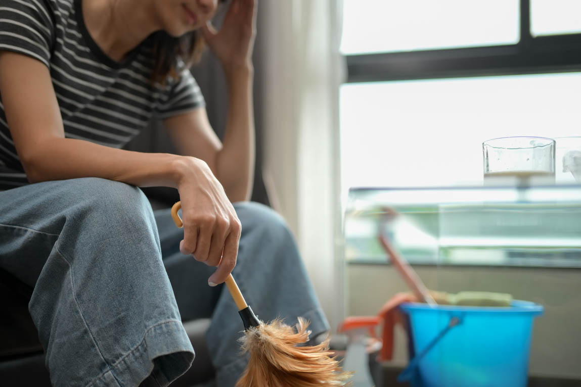 stressed woman cleaning home