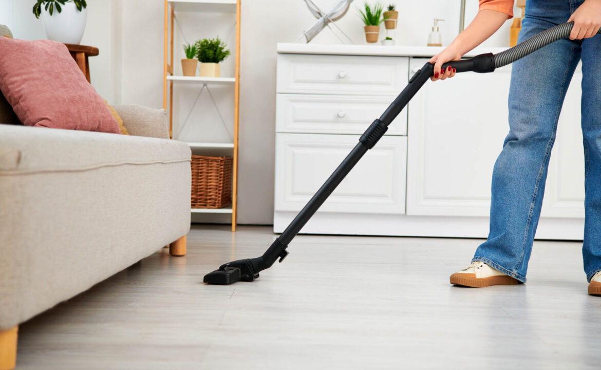 house cleaner vacuuming floors